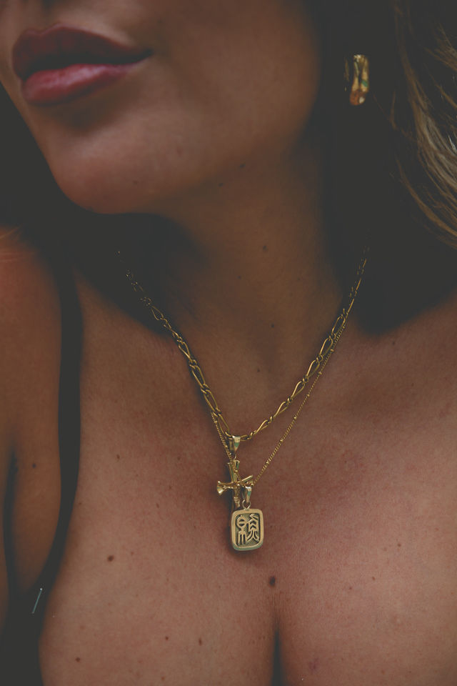Close-up of elegant jewellery adorning a woman's chest, symbolizing self-worth and divine femininity