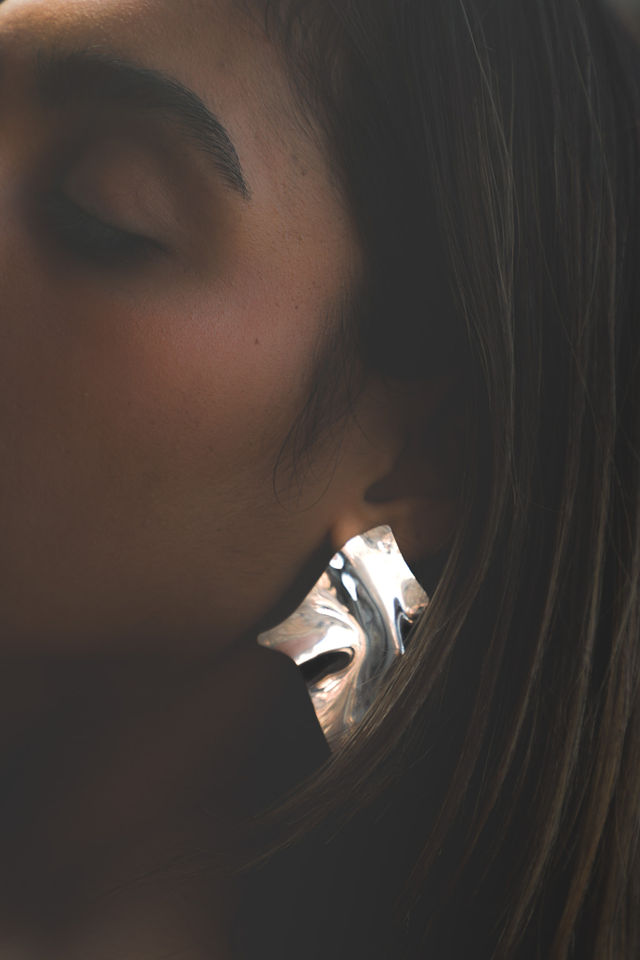Woman journaling in morning sunlight representing 2026 healthy habits and glow up transformation through identity change
