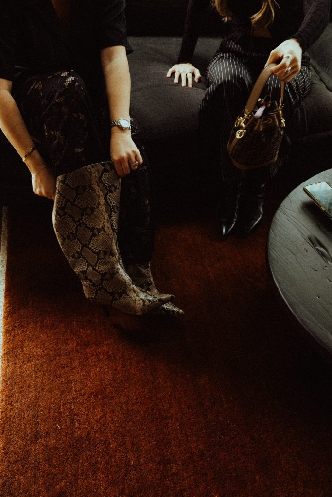 Woman creating 2026 vision board photos for manifestation and glow up transformation with identity shift techniques