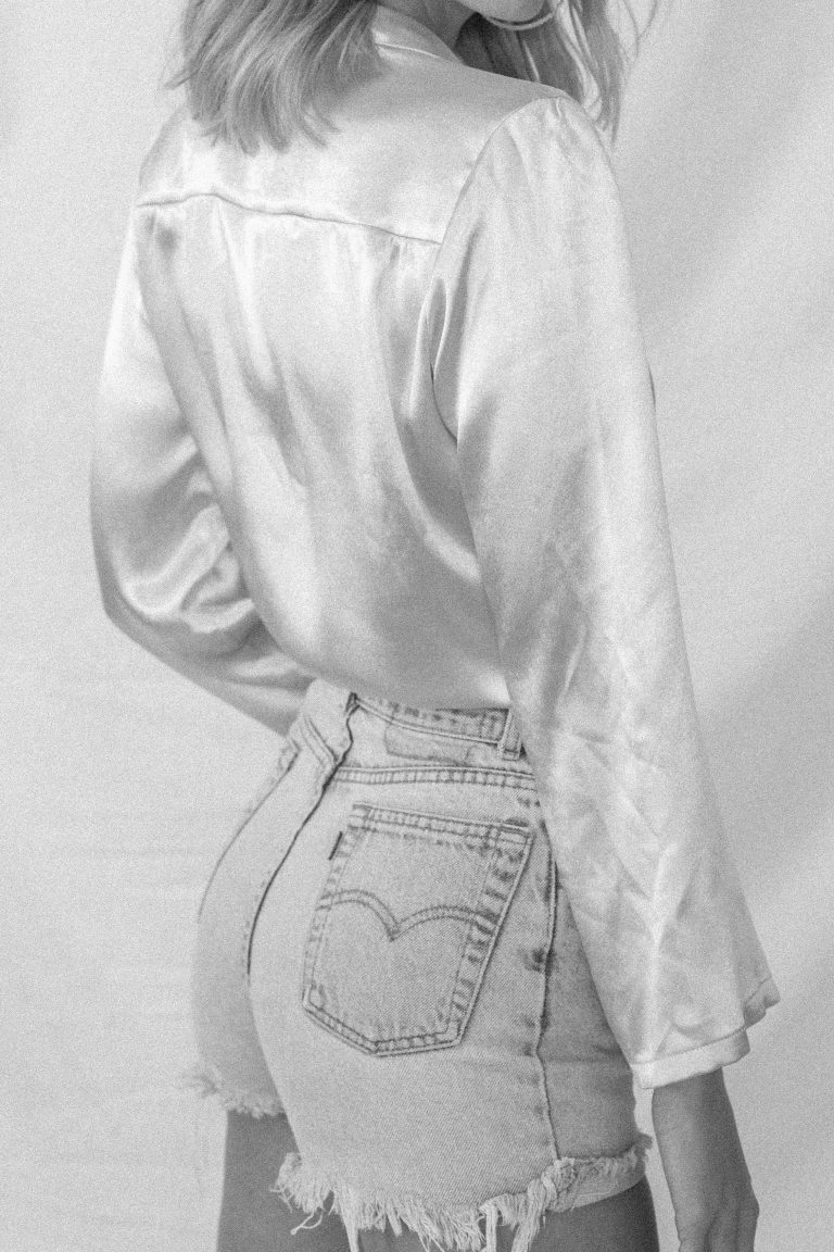 Young woman in aesthetic morning routine setting with journal, matcha latte, and plants representing that girl lifestyle and identity transformation