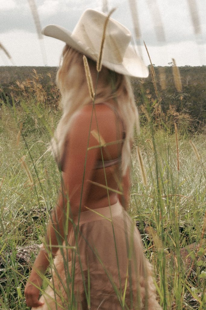 Woman embodying her 2026 dream life through identity transformation and subconscious reprogramming, not just vision boards