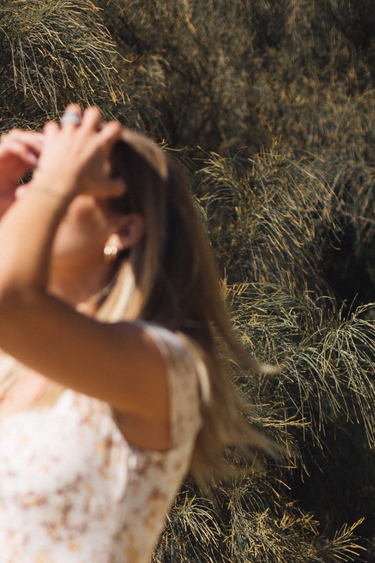 Woman journaling manifestation affirmations in aesthetic that girl morning routine with vision board and coffee